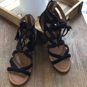 Black faux suede sandals with tassles size 6